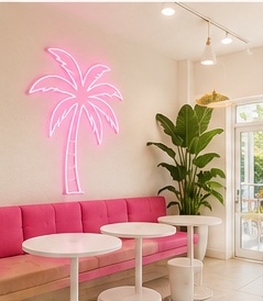 Pink lounge seating and neon palm detail
